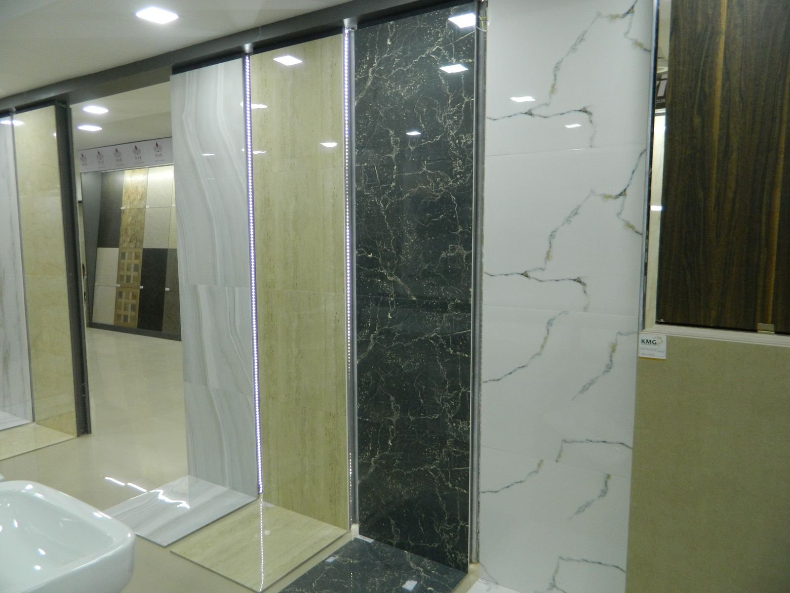 Large format marble look tiles displayed in the showroom
